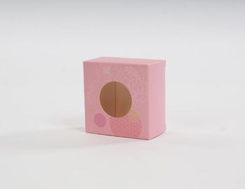 ピンクのアイボリーのボール紙のカウンターの陳列台の化粧品のギフトの包装